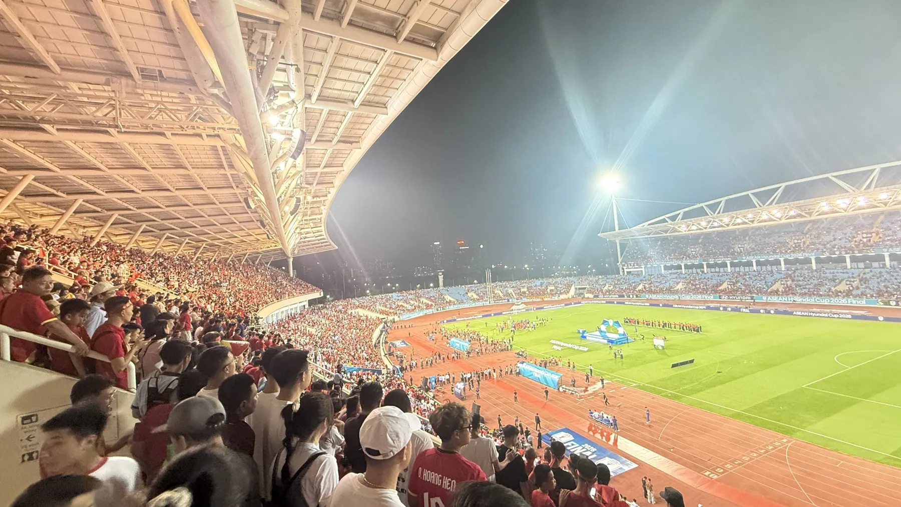 Packed stands under stadium floodlights